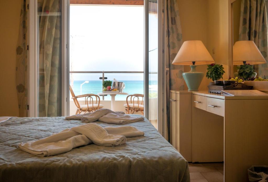 Postel nebo postele na pokoji v ubytování Hotel Coral