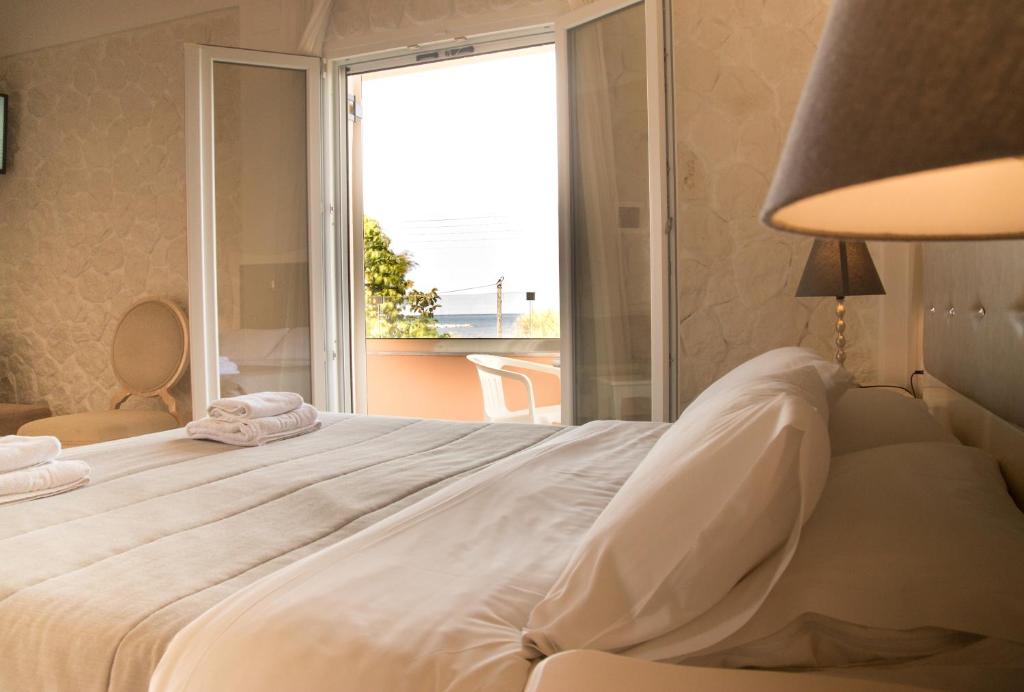 Postel nebo postele na pokoji v ubytování Hotel Coral
