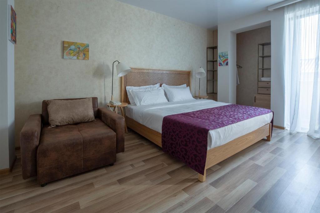 Postel nebo postele na pokoji v ubytování Ornament Boutique Hotel