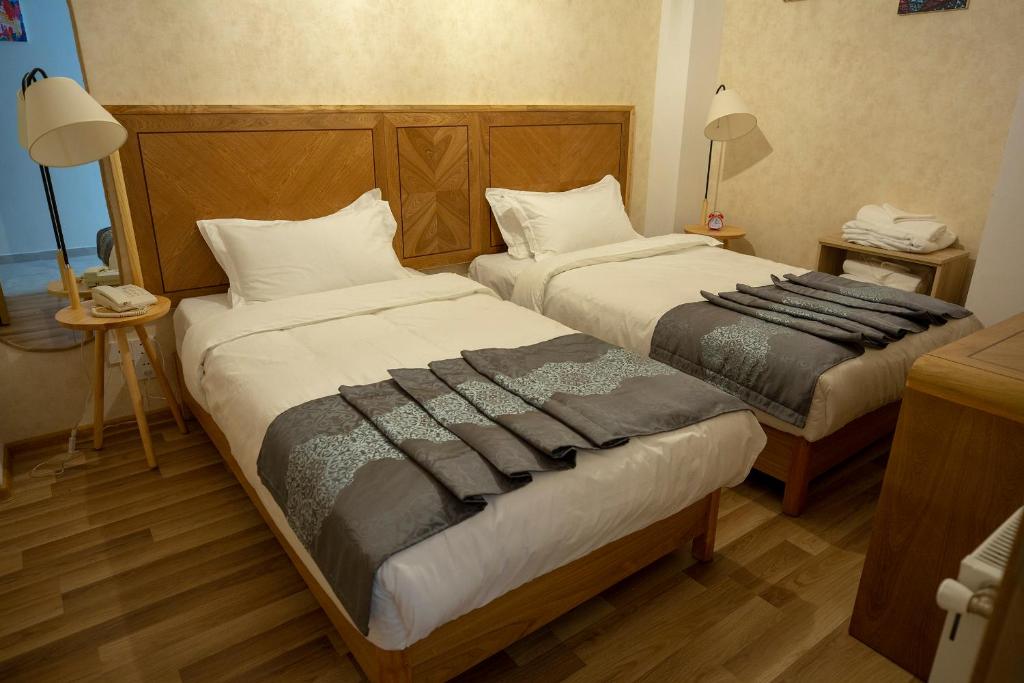 Postel nebo postele na pokoji v ubytování Ornament Boutique Hotel