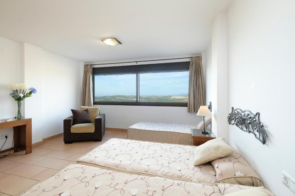 Cama o camas de una habitación en Los Castillarejos Apartamentos Rurales