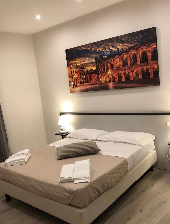 Postel nebo postele na pokoji v ubytování Hotel Arena