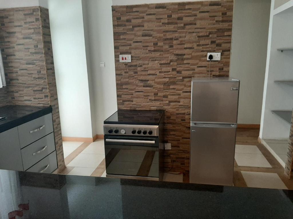 Kuchyň nebo kuchyňský kout v ubytování D2W Residency Suites