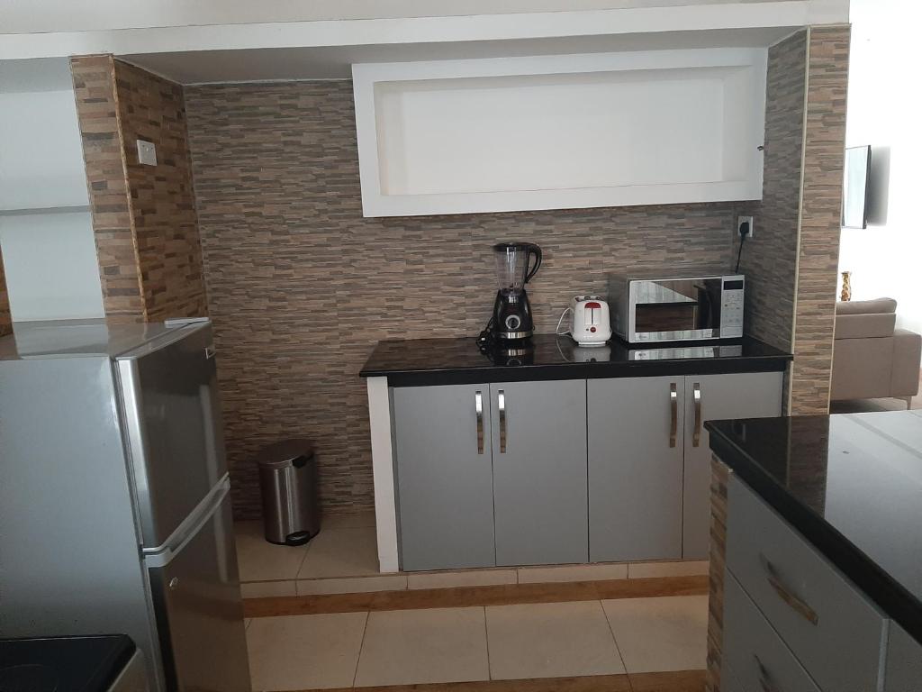 Kuchyň nebo kuchyňský kout v ubytování D2W Residency Suites