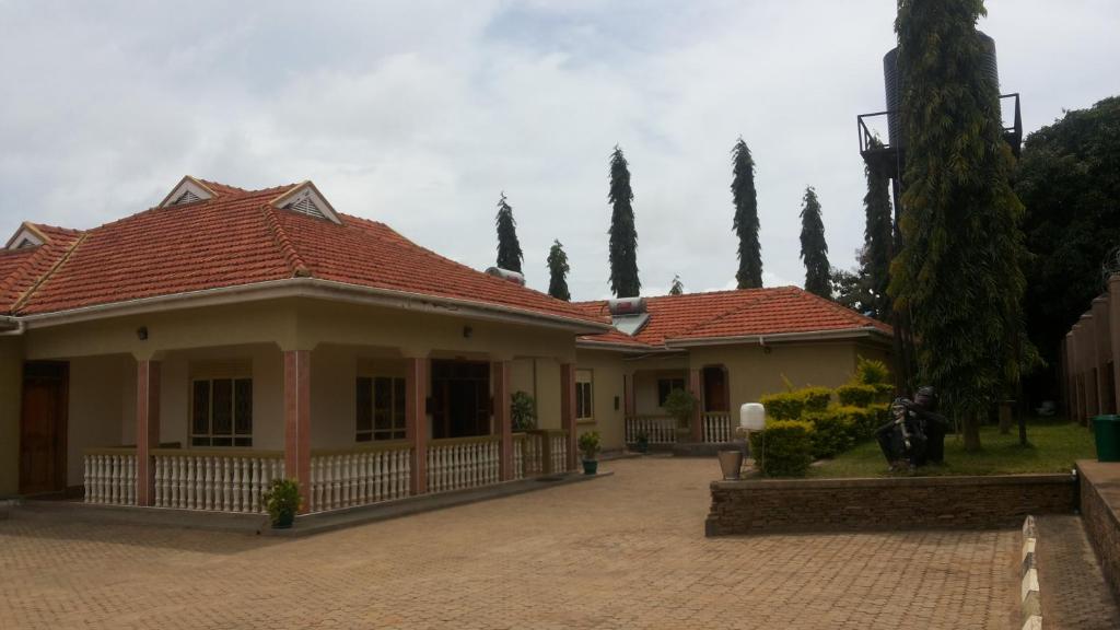 a house with a tiled roof and a courtyard at Nasera Suites Hotel in Moyo