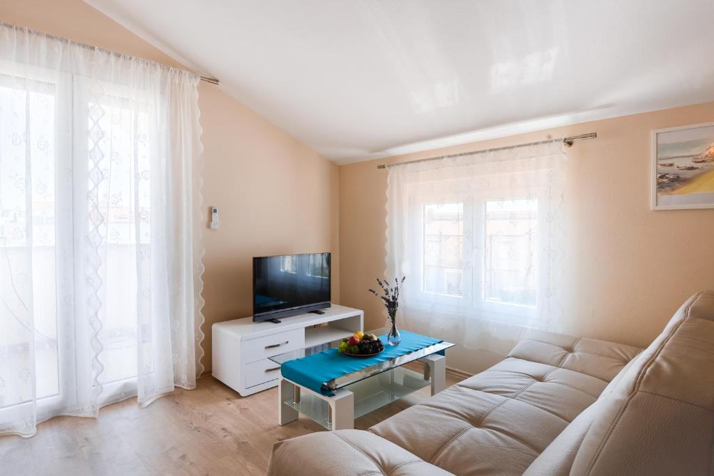 Telewizja i/lub zestaw kina domowego w obiekcie Villa Hope Apartments