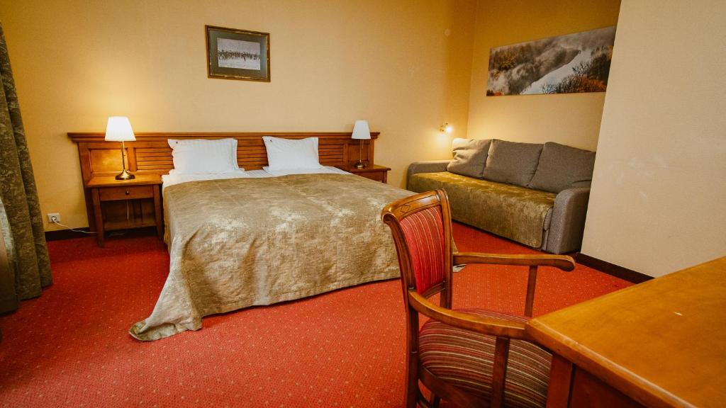 Postel nebo postele na pokoji v ubytování Kaķītis hotel & spa