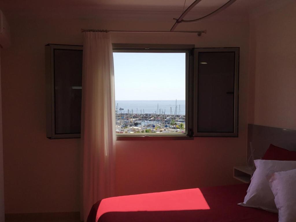 A bed or beds in a room at Sunset Puerto de Mogan