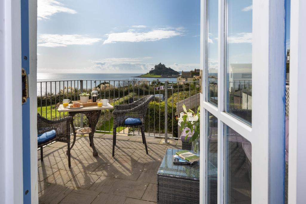 a view of the ocean from the balcony of a house at Trevara, Marazion in Marazion