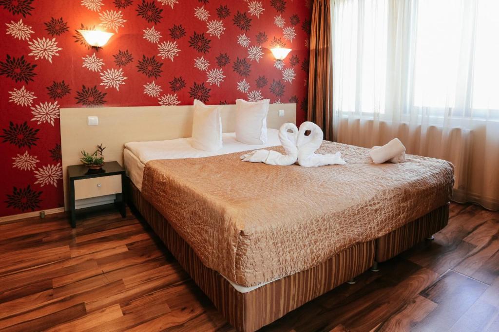 Postel nebo postele na pokoji v ubytování Vila Vidalis