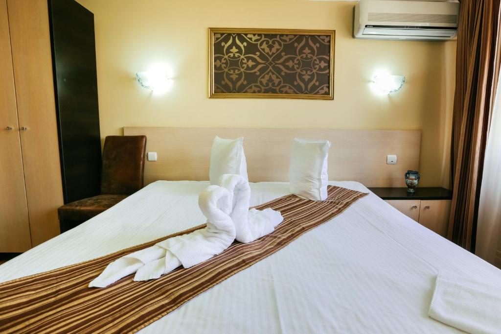 Postel nebo postele na pokoji v ubytování Vila Vidalis