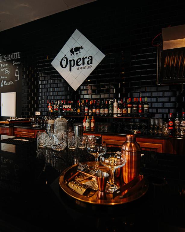 a bar with a tray of glasses on a table at Urban Anaga Hotel in Santa Cruz de Tenerife