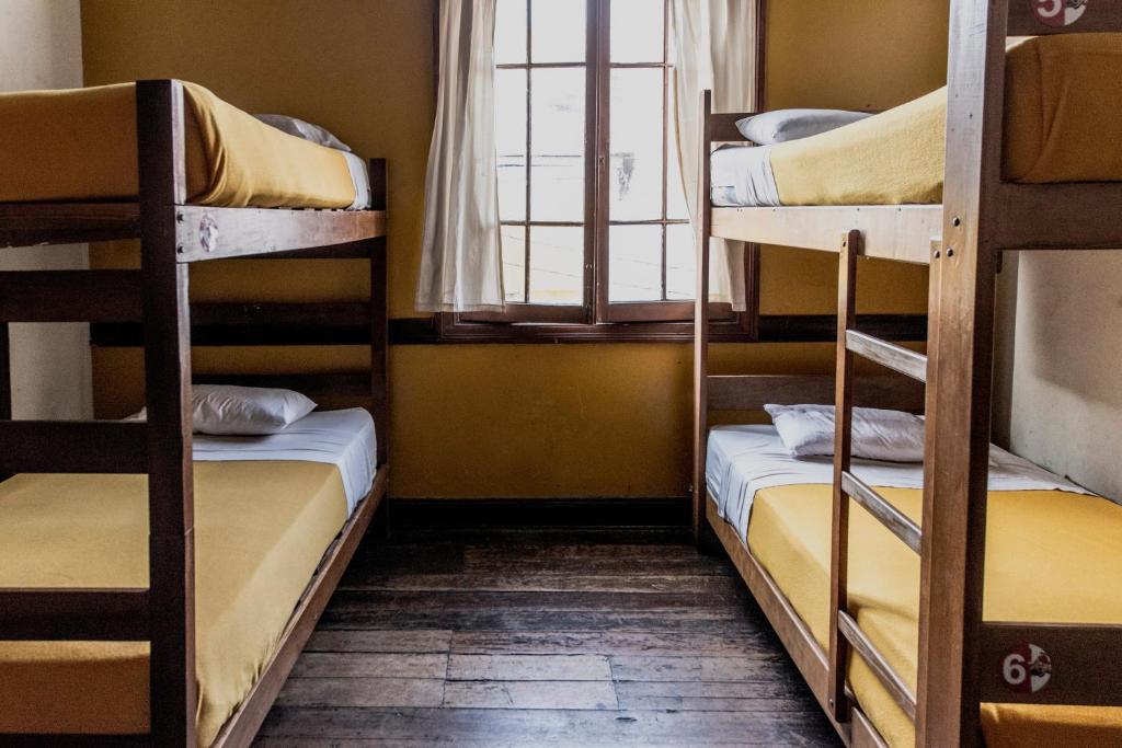 Postel nebo postele na pokoji v ubytování Flying Dog Lima B&B