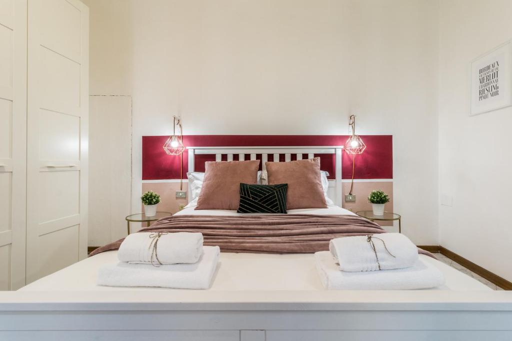 Łóżko lub łóżka w pokoju w obiekcie Wine Apartments Florence Sangiovese