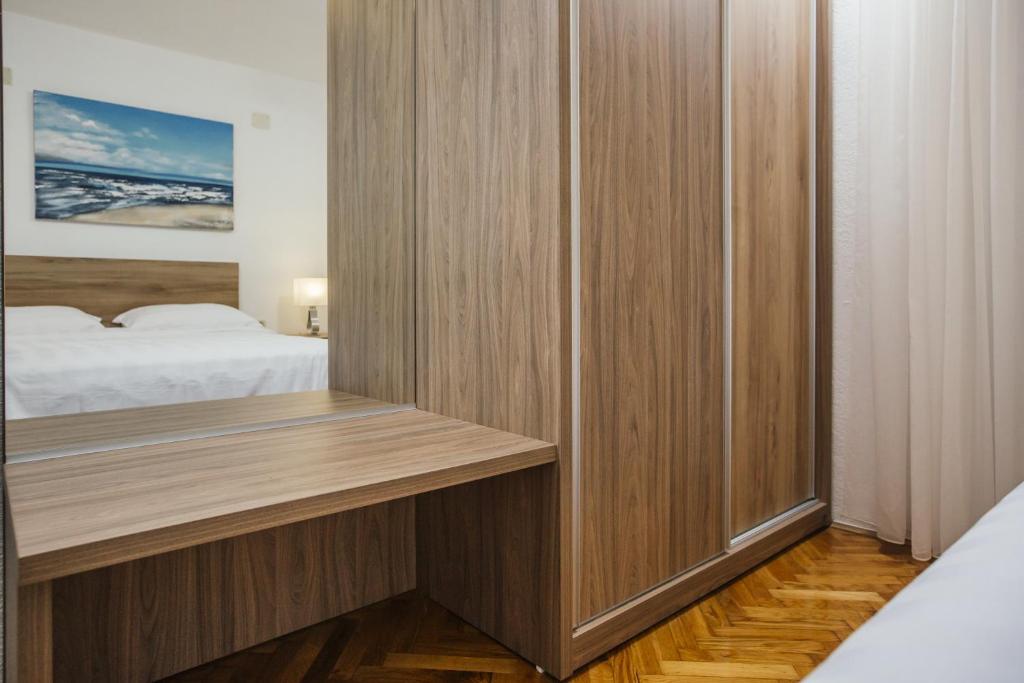 Posteľ alebo postele v izbe v ubytovaní Apartments Bago