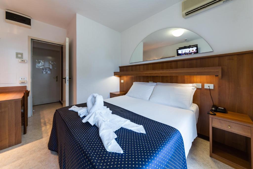 Postel nebo postele na pokoji v ubytování Hotel Vina De Mar
