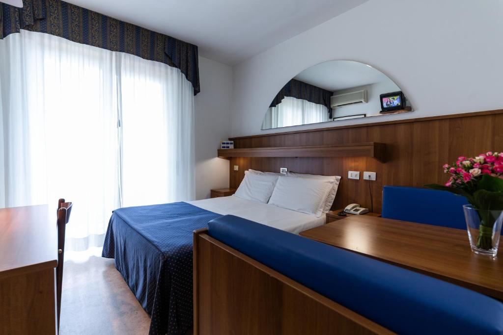 Postel nebo postele na pokoji v ubytování Hotel Vina De Mar