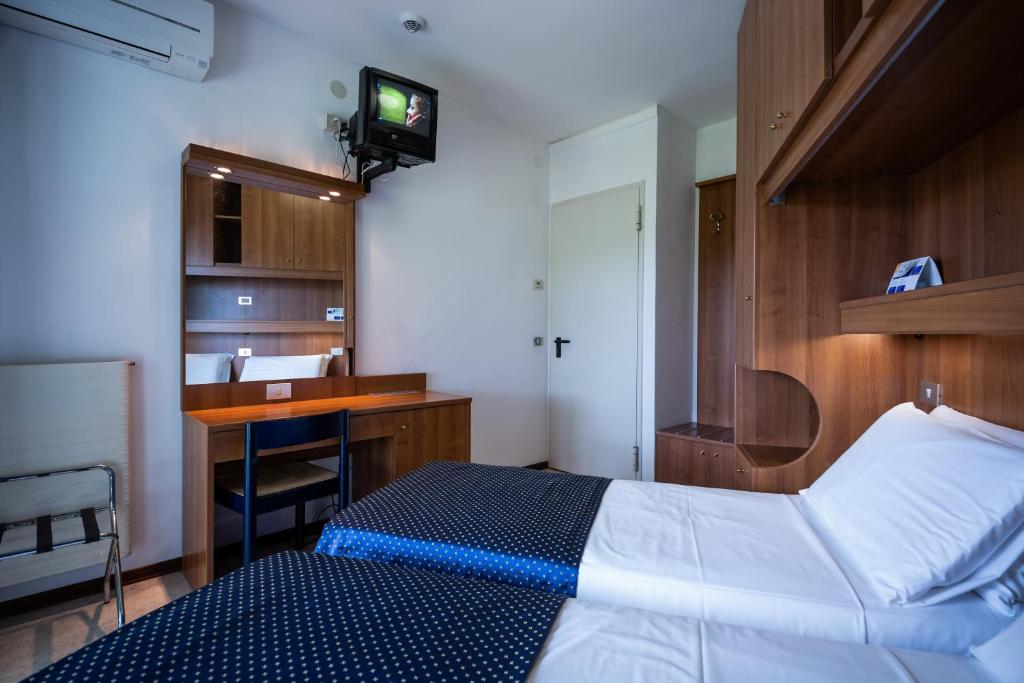 Postel nebo postele na pokoji v ubytování Hotel Vina De Mar