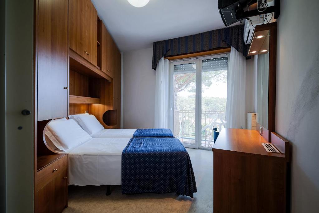 Postel nebo postele na pokoji v ubytování Hotel Vina De Mar