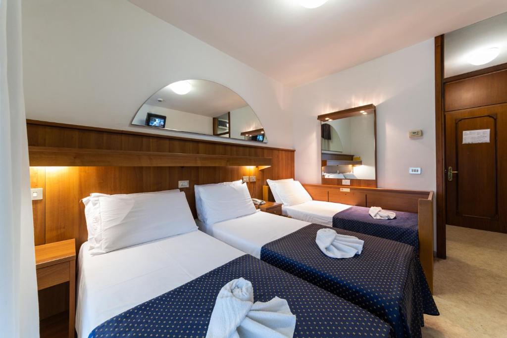 Postel nebo postele na pokoji v ubytování Hotel Vina De Mar