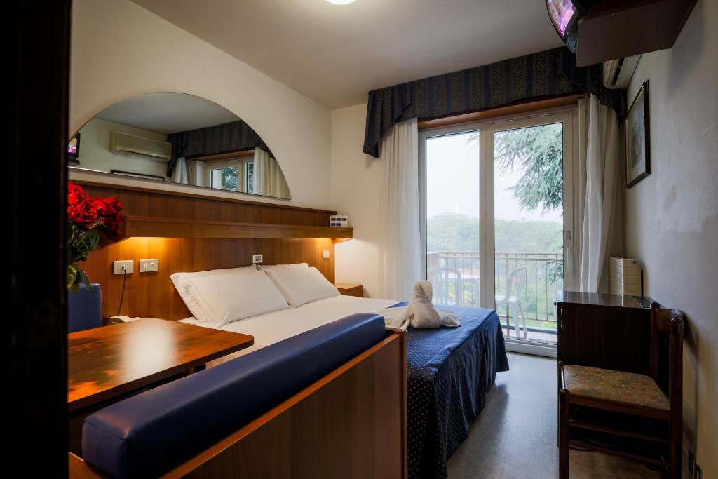 Postel nebo postele na pokoji v ubytování Hotel Vina De Mar