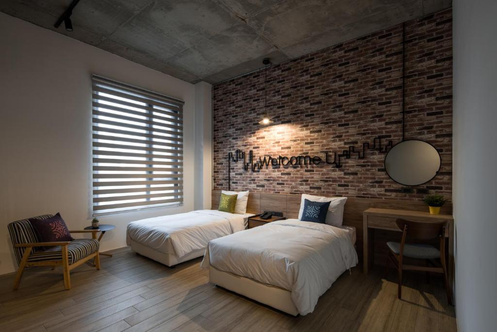 Postel nebo postele na pokoji v ubytování Tian Zhong Hotel