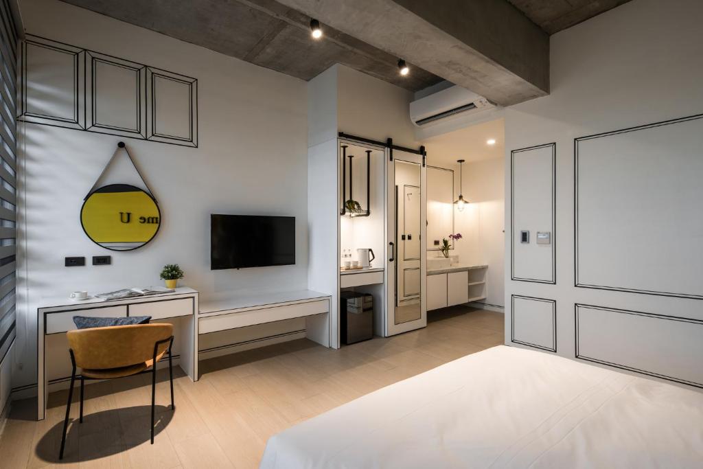Postel nebo postele na pokoji v ubytování Tian Zhong Hotel