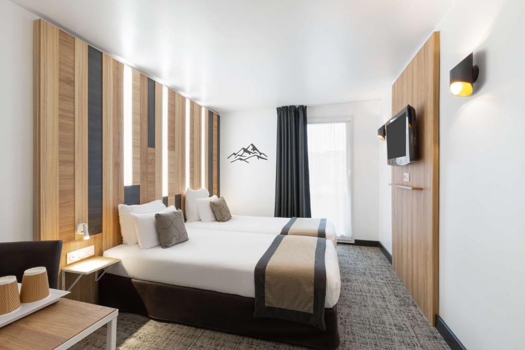 Ein Bett oder Betten in einem Zimmer der Unterkunft Best Western Hotel International