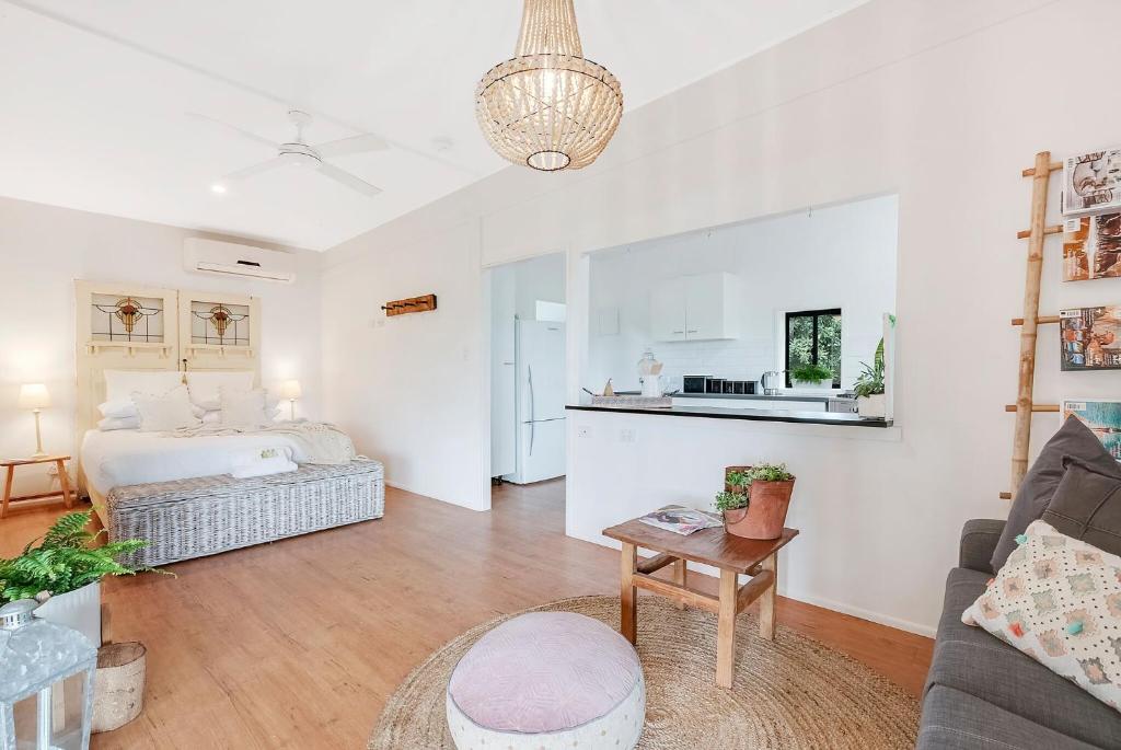 a living room with a bed and a table at Farm & Co-sy by Kingscliff Accommodation in Cudgen