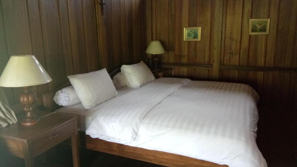 Postel nebo postele na pokoji v ubytování Gardenia Country Inn