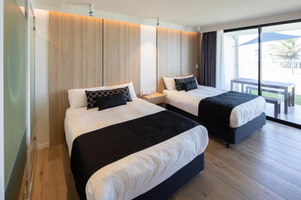 Letto o letti in una camera di Ocean Front Motel
