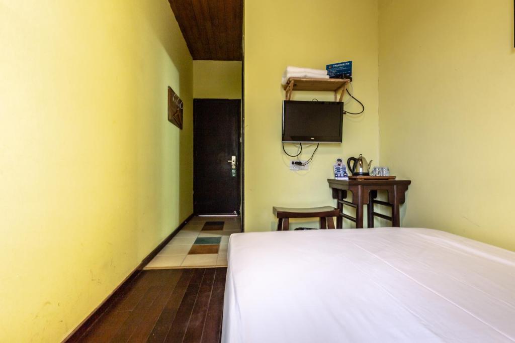 Postel nebo postele na pokoji v ubytování Hofang Guest House