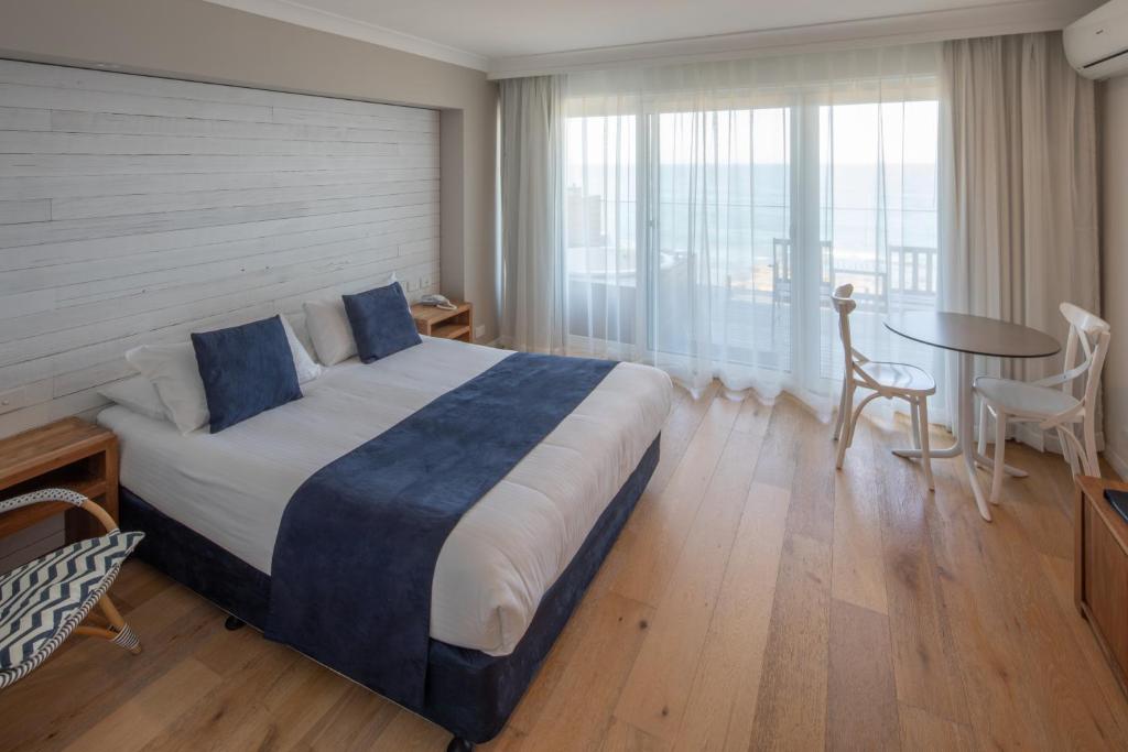 Letto o letti in una camera di Ocean Front Motel