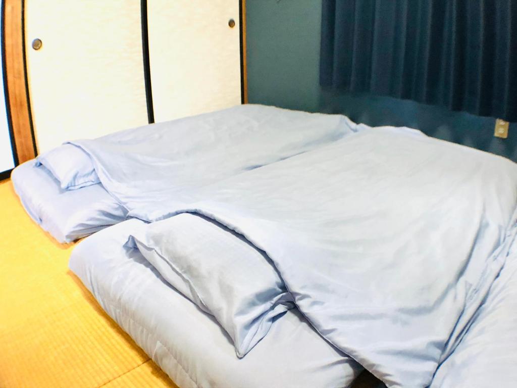 Postel nebo postele na pokoji v ubytování Habitacion NIIYA Mt Fuji