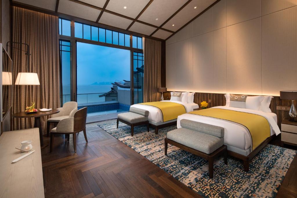 Postel nebo postele na pokoji v ubytování Angsana Zhuhai Phoenix Bay