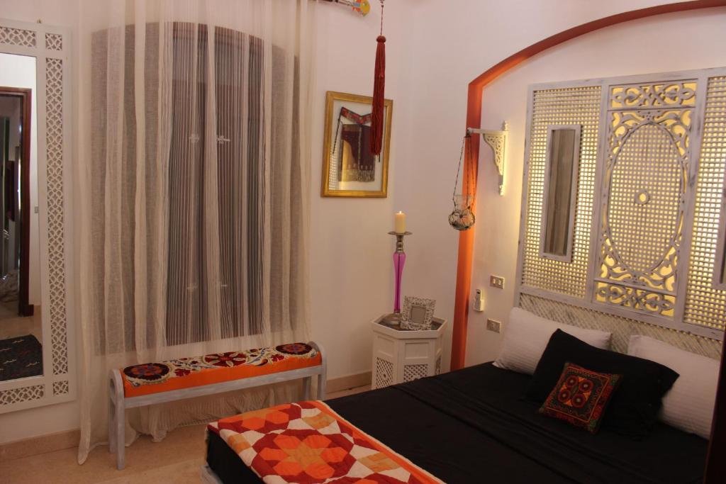 A bed or beds in a room at Beit Matta