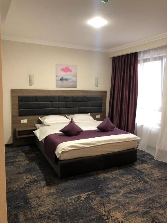 Postel nebo postele na pokoji v ubytování Hotel Yarus Plus