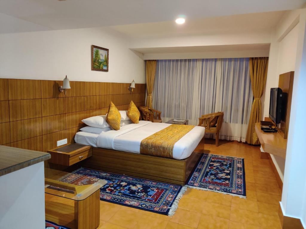 Rúm í herbergi á Hotel Tarayana