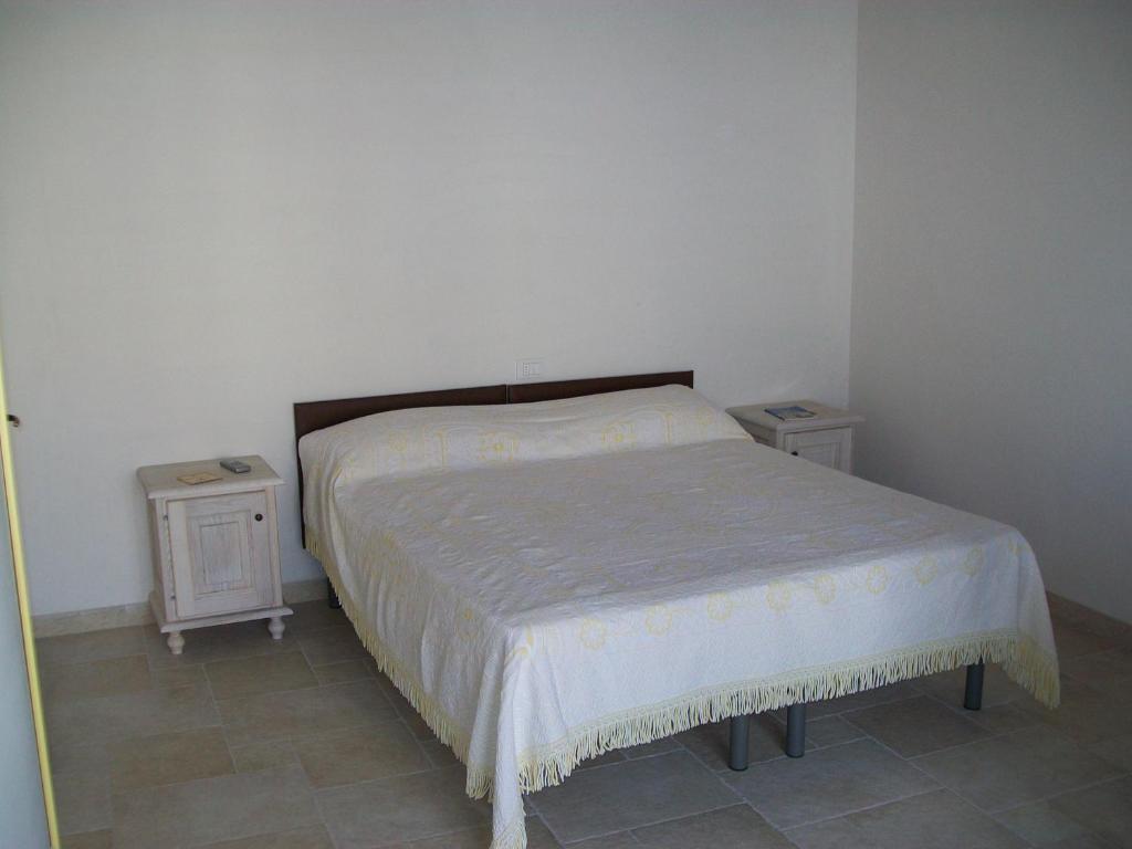 Postel nebo postele na pokoji v ubytování masseria Carlini