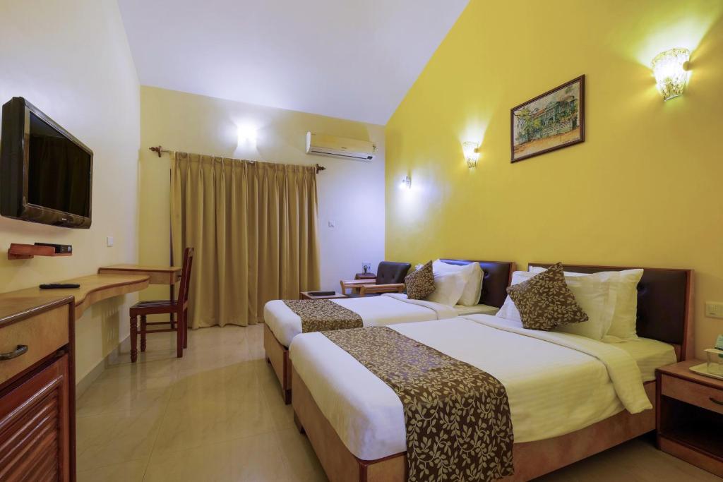 Postel nebo postele na pokoji v ubytování Spazio Leisure Resort, Goa