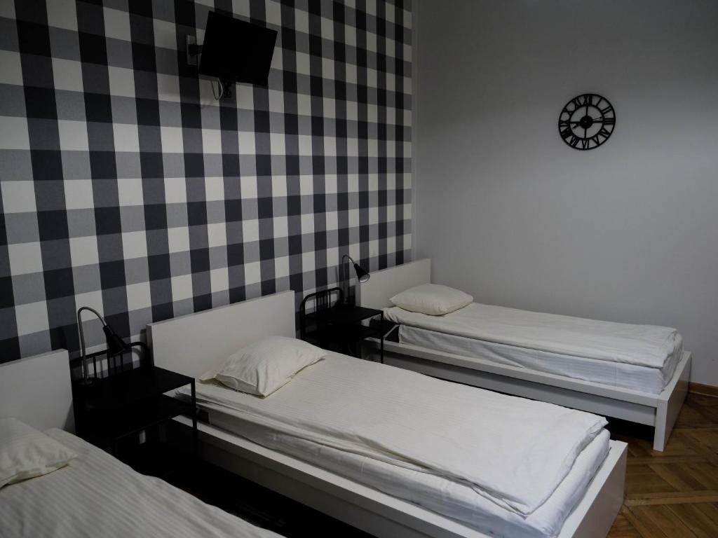 Posteľ alebo postele v izbe v ubytovaní Cent Hostel