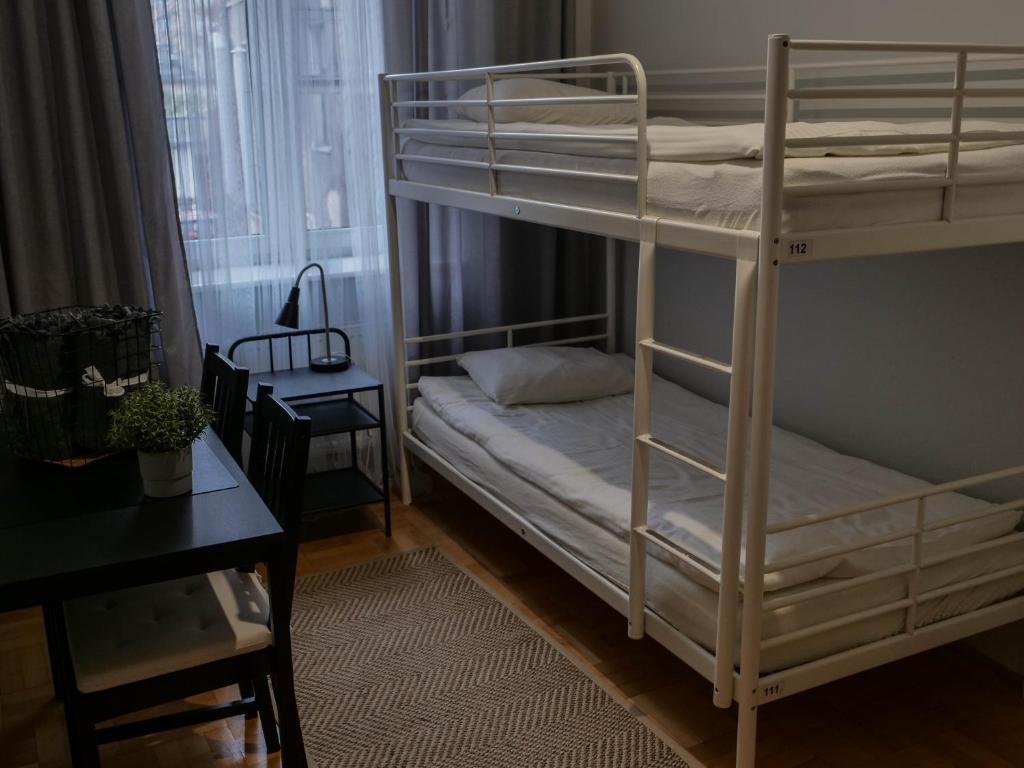 Posteľ alebo postele v izbe v ubytovaní Cent Hostel