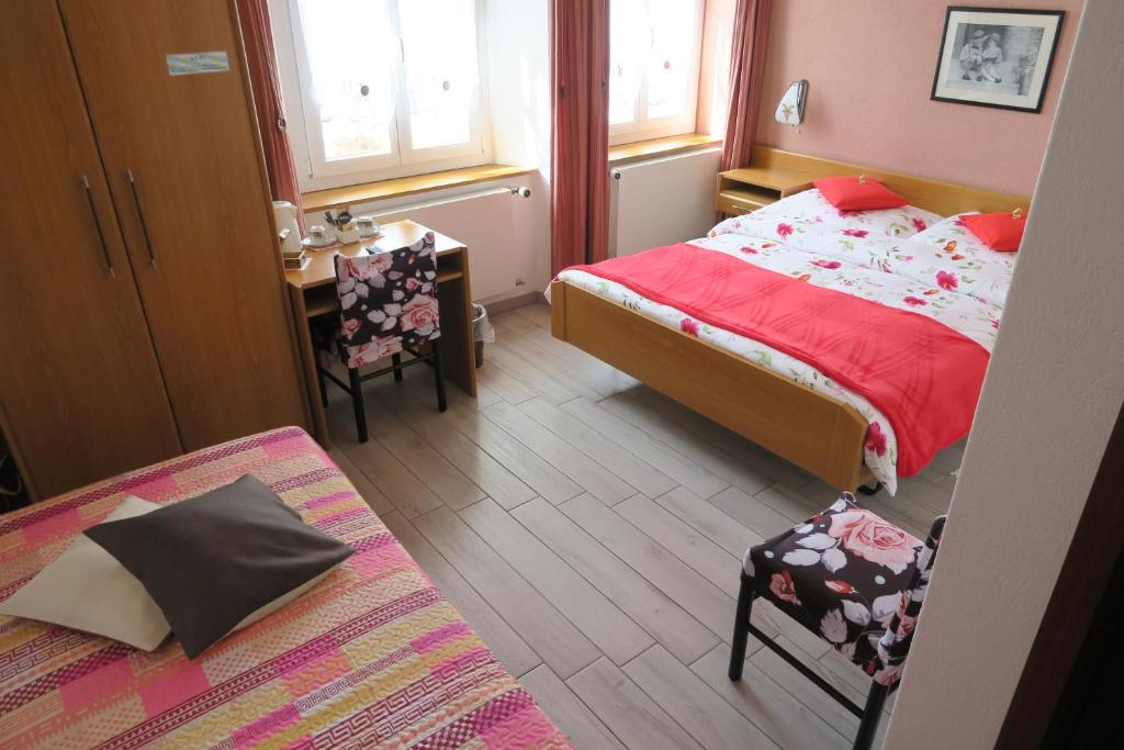 Postel nebo postele na pokoji v ubytování L'Union B&B - Chambres d'hôtes