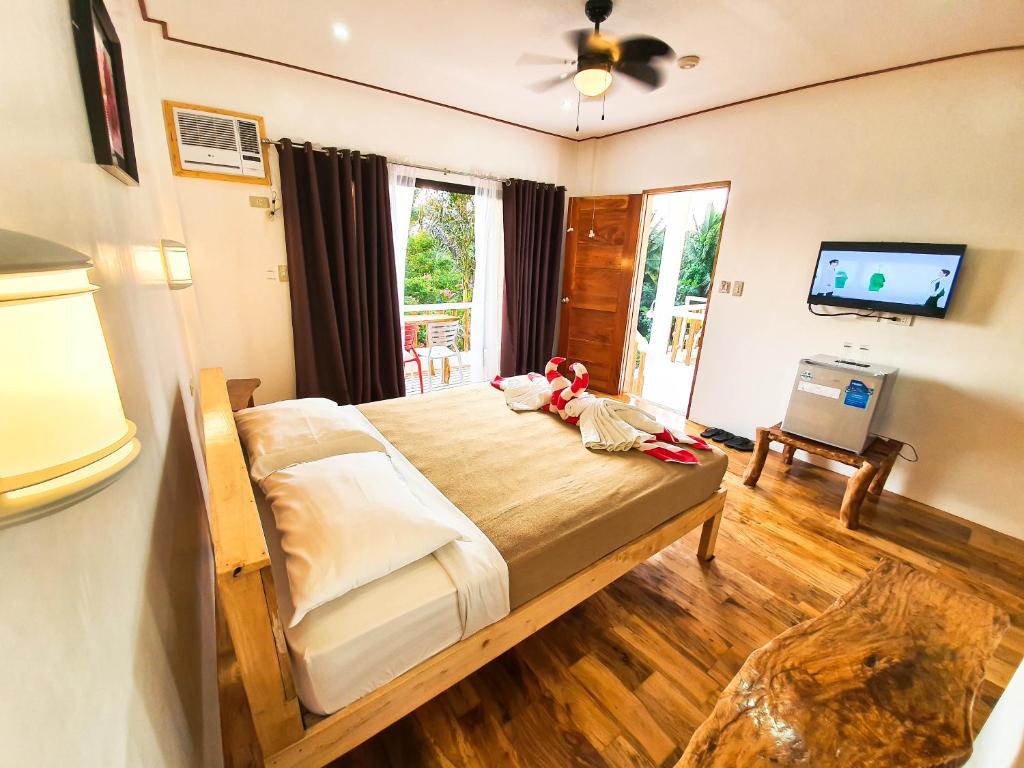 TV a/nebo společenská místnost v ubytování Cocoloco Beach Resort