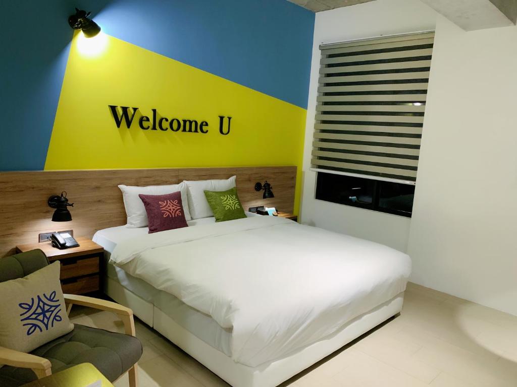 Postel nebo postele na pokoji v ubytování Tian Zhong Hotel