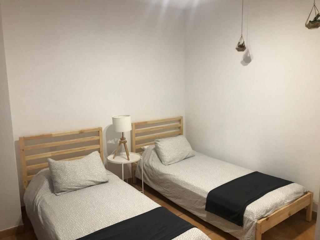 En eller flere senge i et værelse på Center Holiday Corralejo