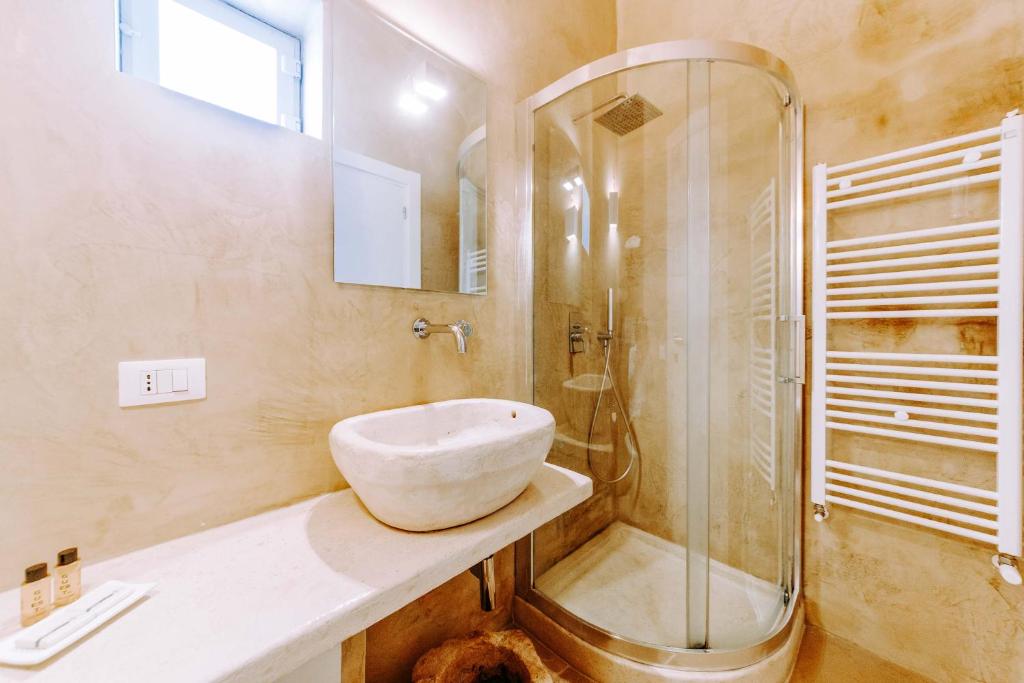 a bathroom with a sink and a shower at Dimora Anderì in Polignano a Mare