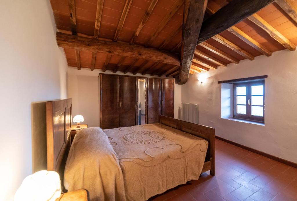 Postel nebo postele na pokoji v ubytování Fattoria di Cintoia