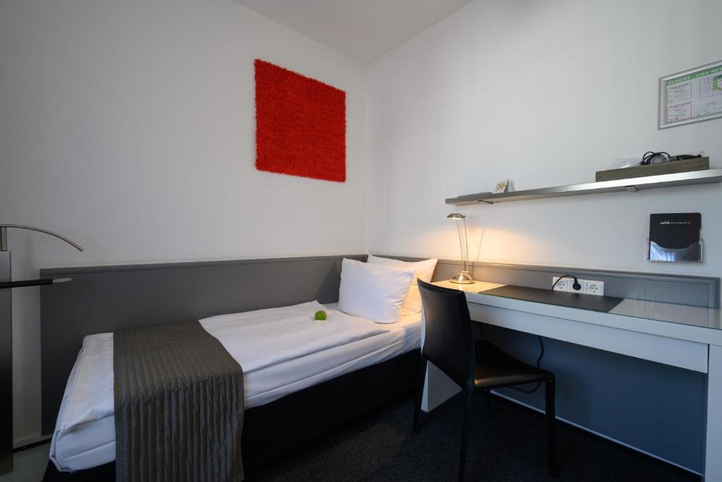 Postel nebo postele na pokoji v ubytování Hotel Heymann