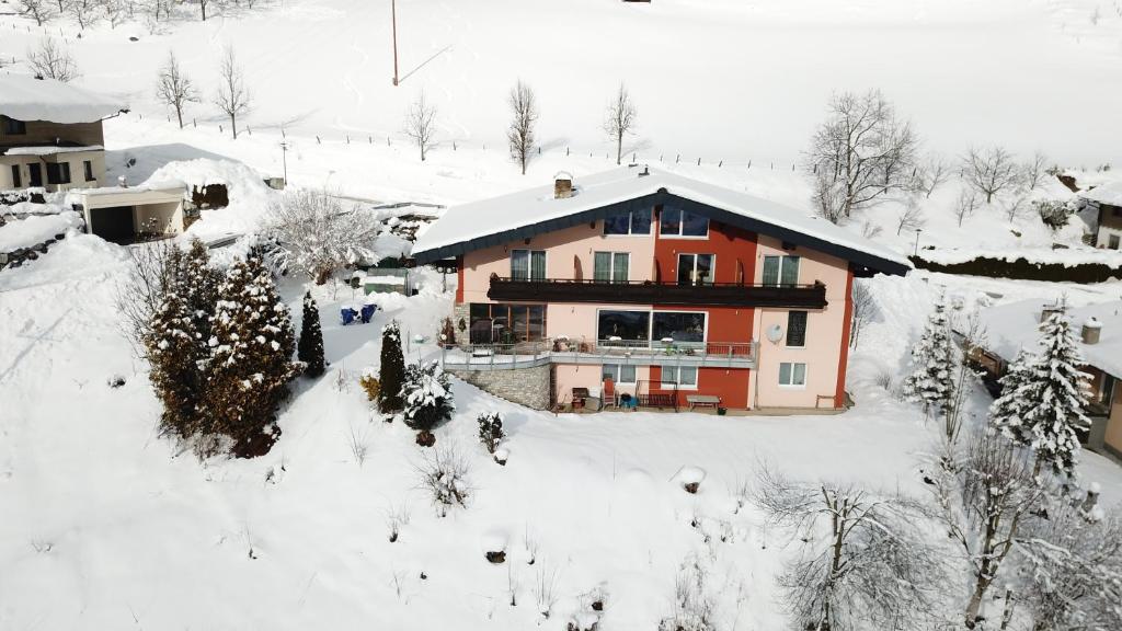 an aerial view of a house in the snow at Alpenappartement Claudia in Piesendorf